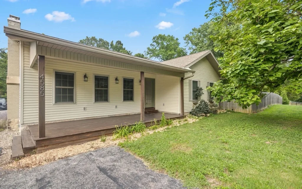 Ranch home with a covered front porch on five acres at 4585 E Robinson Rd, Bloomington