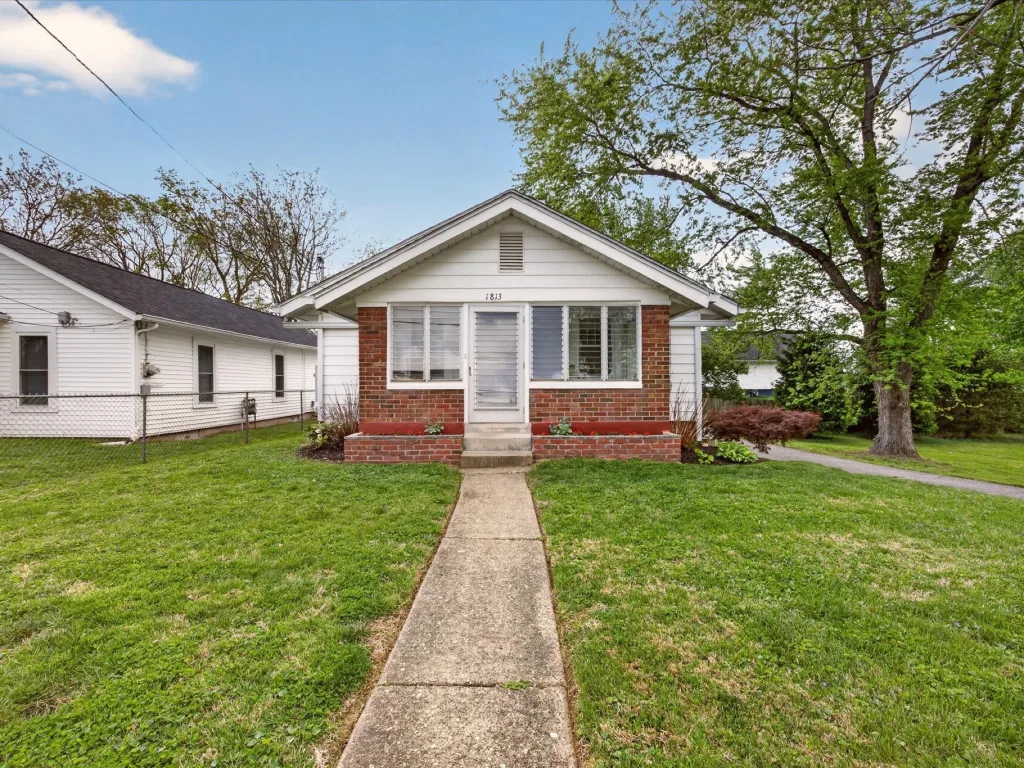 Bungalow with a front walk and lawn at 1813 W Wylie St, Bloomington