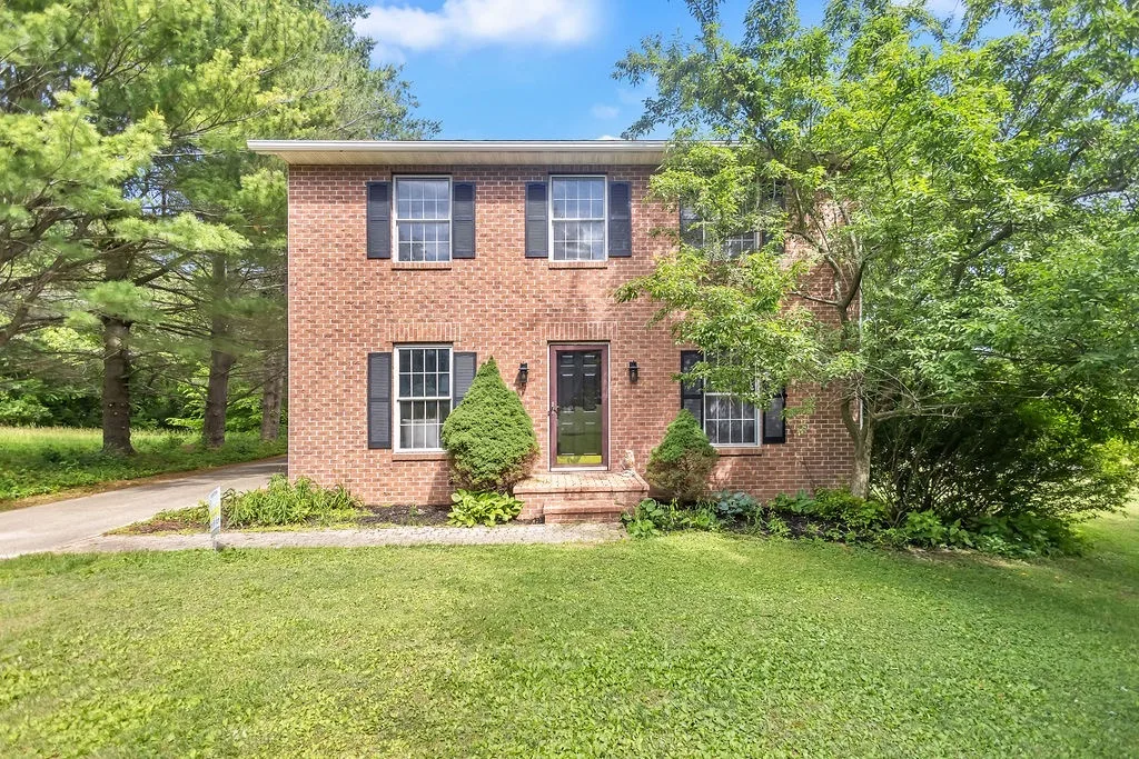 Brick two-story home on a wooded lot at 4690 E State Road 45, Bloomington