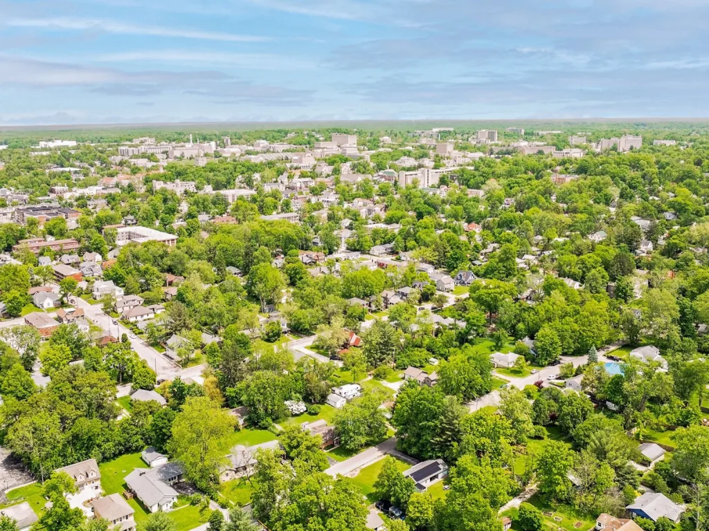 Aerial view of a tree-covered Bloomington neighborhood