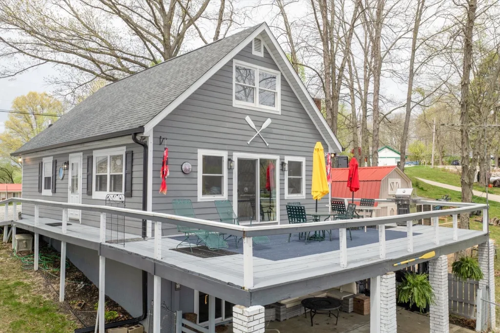 Lake Lemon home with a large deck facing the water