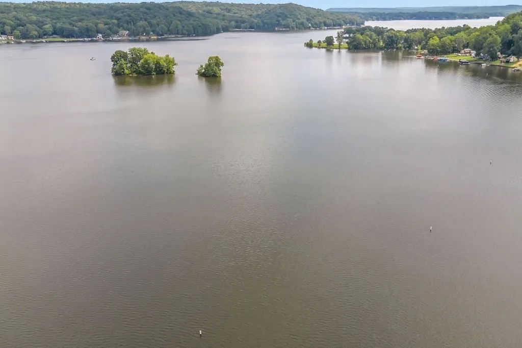 Open water on Lake Lemon with wooded hills beyond